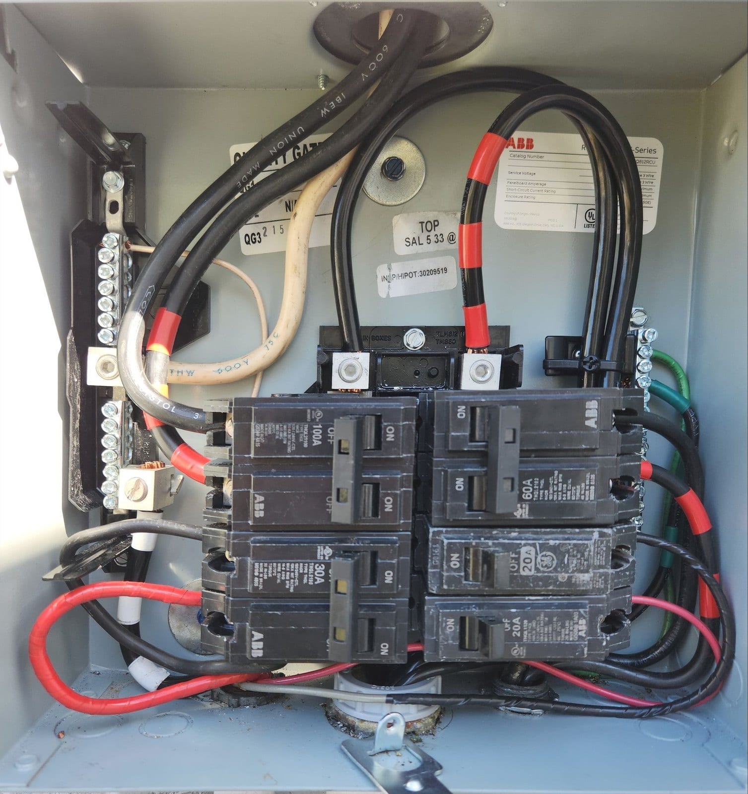 Residential load centre interior with breakers installed and feeders neatly landed